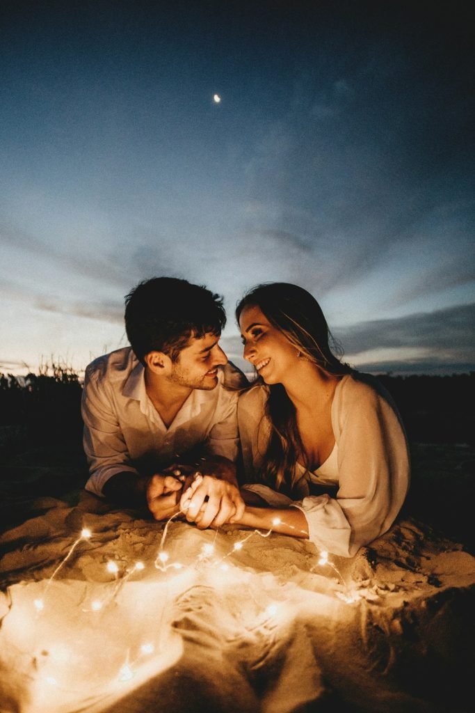 man-and-woman-kissing-on-sand-during-daytime-pgids5pkwns