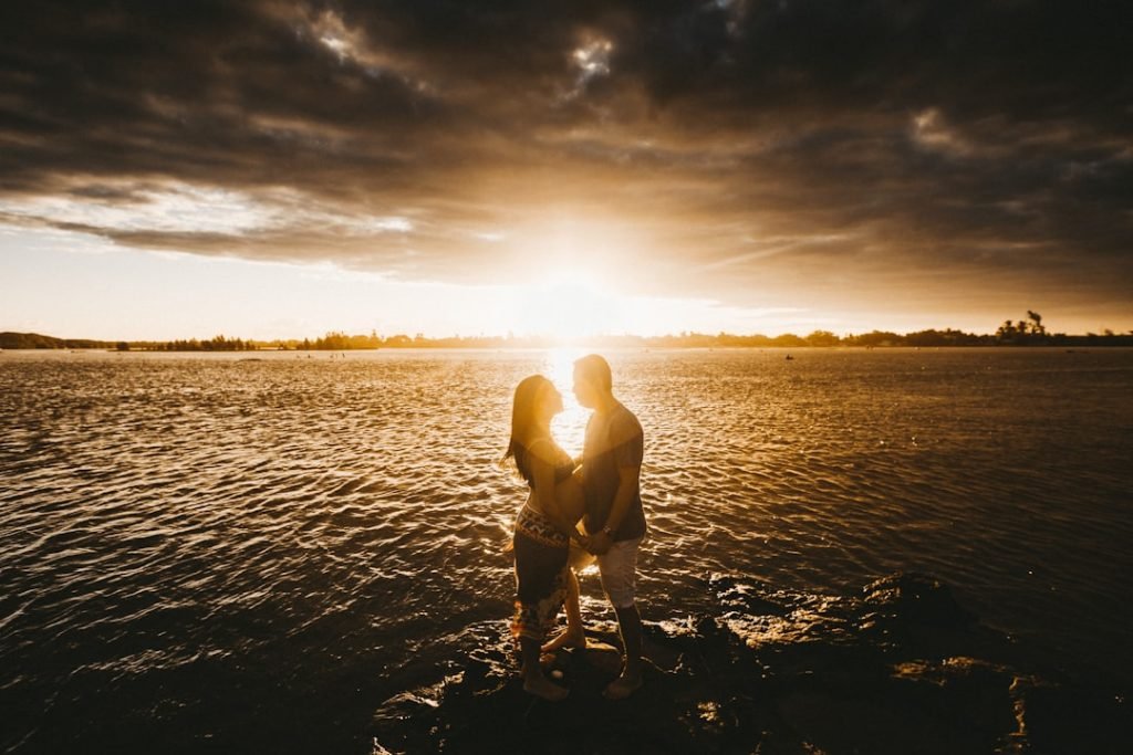 man-in-white-shorts-running-on-beach-during-sunset-nzgdvroakia